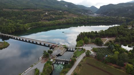 Aerial-drone-shot-of-a-bridge-above-Haliacmon-Aliakmon-river-in-northern-Greece-Macedonia
