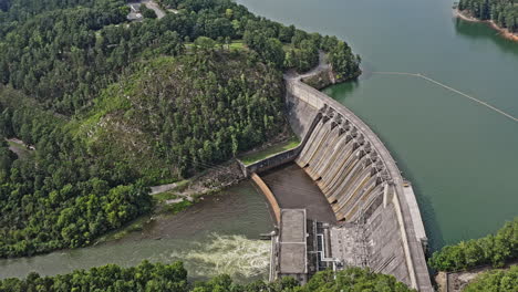 Allatoona-Dam-Georgia-Aerial-v1-birds-eye-view,-natural-landscape-of-concrete-gravity-dam-and-beautiful-freshwater-reservoir-surrounded-by-mountain-greenery---August-2021