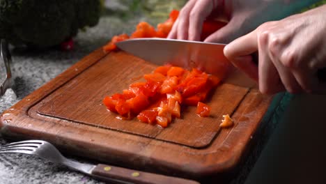 Chopping-Fresh-Red-Bell-Pepper-On-Wooden-Board-For-Red-Pepper-Pickle-Recipe