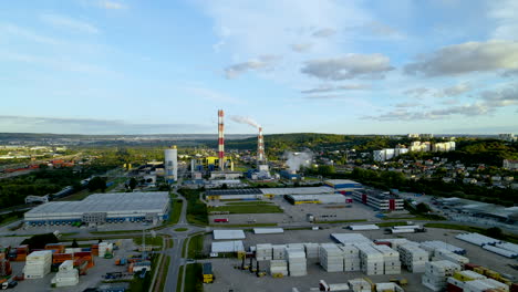 Industrial-Site-NearGdynia-Harbor-In-Poland-Overlooking-Greenery---aerial-wide-shot