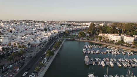 Beautiful-pier-and-white-building-city-of-Ayamonte,-Spain,-aerial-orbit-view