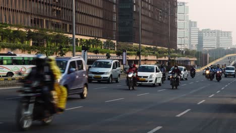 Action-camera-video-of-the-city-roads-with-different-vehicles-like-tuk-tuk,-mopeds,-motor-cycles,-buses-in-the-metropolitan-city,-Hyderabad