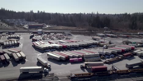 Trucks-and-containers-in-cargo-zone-at-Surrey,-Vancouver-in-Canada