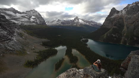 Lonely-Female-Sitting-on-Rock-at-Viewpoint-Above-Lake-O'Hara