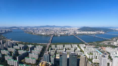 North-Seoul-city-skyline-panorama-from-high-altitude-daytime,-Hangang-with-many-bridges-and-cars-daytime-traffic