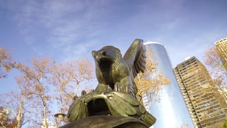 Eagle-sculpture-memorial-in-battery-park-lower-Manhattan-with-metropolitan-skyline-on-background