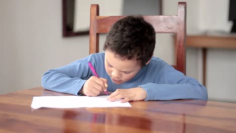 boy-with-school-work-at-home-not-going-back-to-school-due-to-coronavirus-stock-video