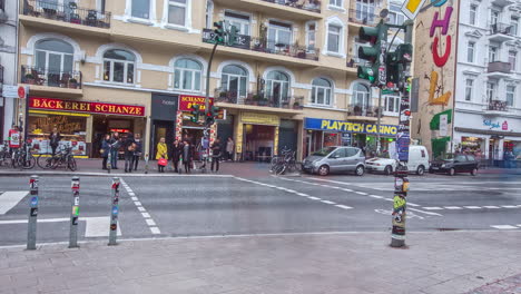 Time-lapse-of-pedestrian-crossing-road-during-busy-traffic-in-schanzenviertel-schanzen-district-of-hamburg-city,germany