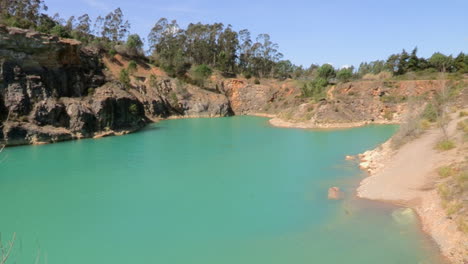 Pond-in-Maiorca-is-an-old-quarry,-the-blue-green-water-looks-like-it-came-out-of-a-paradisiacal-setting