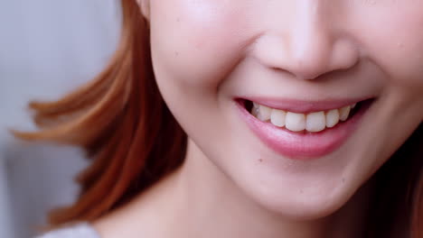 Close-up-of-Mount-lips-smile-of-a-Young-Asian-woman-face-portrait-happy