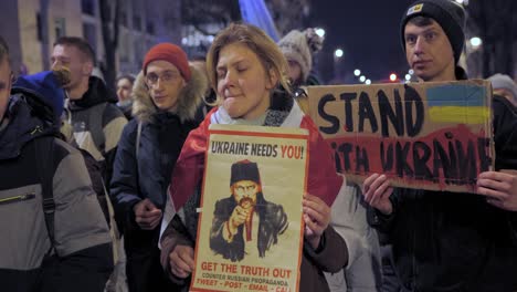 2022-Russia-invasion-of-Ukraine---people-holding-plaques-with-the-slogans-at-an-anti-war-demonstration-in-Warsaw-on-the-very-first-day-of-the-war