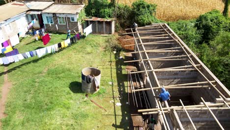 Aerial-drone-view-of-people-working-on-the-rooftop-houses