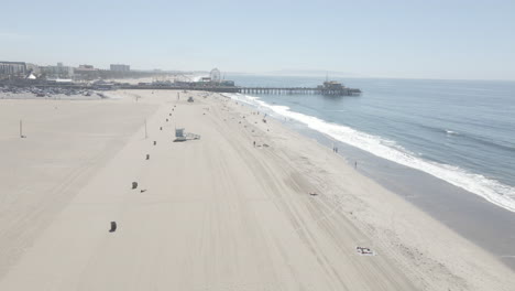 Aerial-of-Santa-Monica-Beach-and-Santa-Monica-Pier-on-a-sunny-California-day