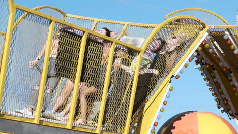 People-on-a-carnival-ride-during-the-day