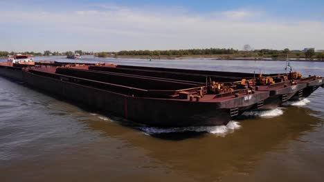 Aerial-Circle-Dolly-Around-Forward-Bow-Of-Veerhaven-Towards-Starboard-Side-Pushing-Barges-Along-Oude-Maas