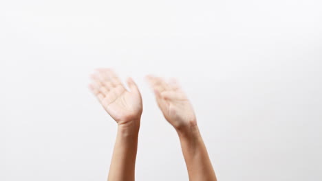 Close-up-of-woman-hand-showing-waving-bye-on-isolated-white-background-with-copy-space