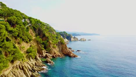 4K-Drone-Shot-Of-Tropical-Coast-Cliffs-In-Costa-Brava,-Blanes