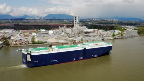 Tug-Boat-And-Roro-Cargo-Ship-At-Fraser-River-With-Cement-Factory-In-The-Background