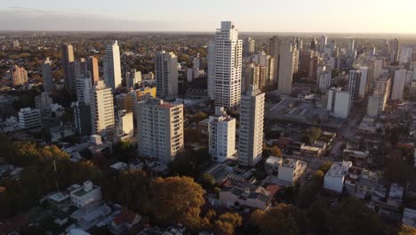 Aerial-cinematic-drone-view-of-Lomas-De-Zamora-city-in-Buenos-Aires-province-at-sunset,-Argentina