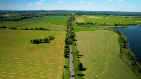 Picturesque-Aerial-View-Of-A-Road-In-Greenery-Landscape-Of-Fields