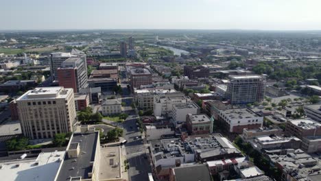 Aerial-view-overlooking-the-Wilmington-cityscape,-summer-in-Delaware,-USA---pan,-drone-shot