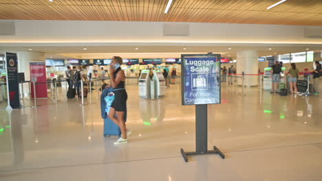 Travelers-at-Phoenix-airport-carrying-luggage-and-bags