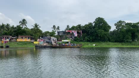 Swarupganj,-also-known-as-Nabadwip-Ghat,-is-a-village-in-Kolkata's-Nadia-district-where-residents-use-large-boats-to-traverse-the-Nabadwip-Ghat