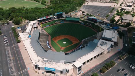 Round-Rock-Express-Dell-Diamond-Baseball-Stadium-aerial-drone-orbit-high-above-field-on-sunny-summer-Texas-day-in-4k