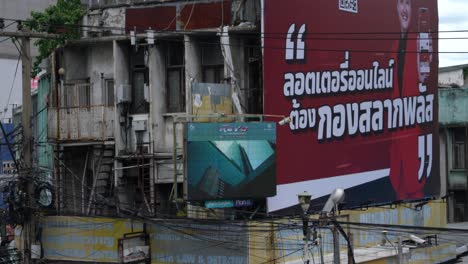 Advertising-digital-screen-on-a-dilapidated-building-downtown-Bangkok