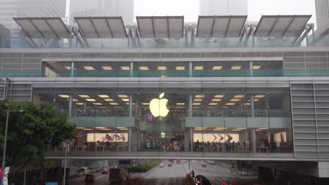 Exterior-of-Apple-Store-in-Central,-Hong-Kong-during-a-rain-storm