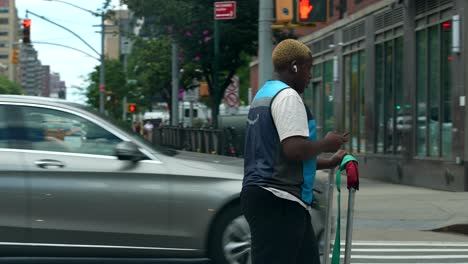Amazon-delivery-worker-crossing-the-street-in-New-York-City