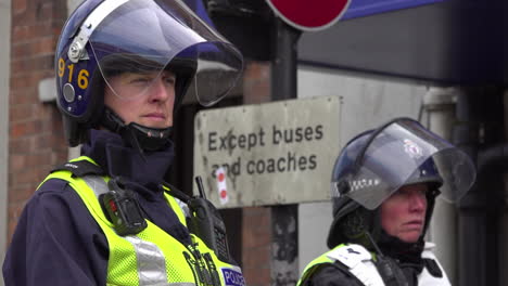 UK-September-2018---Two-police-officers-in-riot-helmets-sat-on-top-of-their-horses