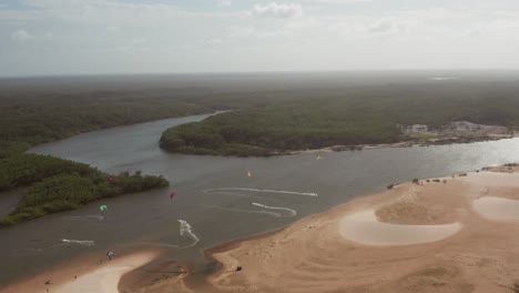Aerial:-Kitesurfing-in-the-river-delta-of-Parnaiba,-Northern-Brazil