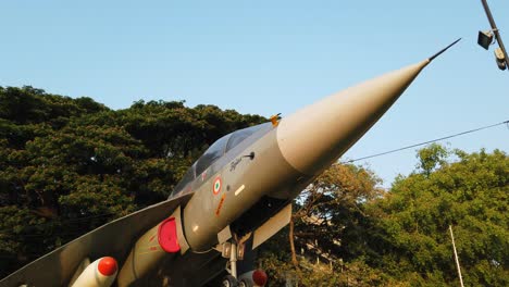 Medium-wide-top-to-bottom-tilt-shot-of-the-LCA-aircraft-installed-in-Cubbon-park-circle-by-HAL-in-Bengaluru,-Karnataka,-India