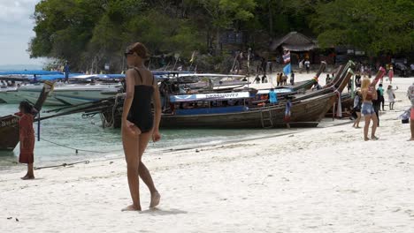 Travelers-travel-to-the-island-by-boat-to-see-the-beauty-and-sunbathing-at-the-beach-front,-with-a-long-beach,-suitable-for-swimming-at-Krabi-in-Thailand