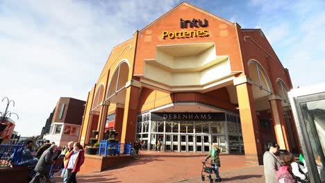 People-shopping,-walking-outside-the-Intu-Potteries-Shopping-Centre-in-Hanley-city-centre-the-main-mall,-precinct