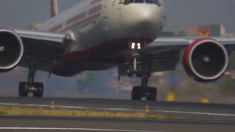 Flight-landing-in-slow-motion-video-at-a-busy-airport