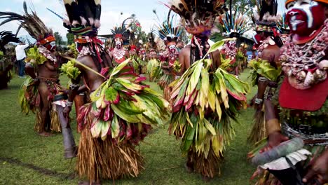 Cultural-dancers-perform-in-feather-headdresses,-face-paint-with-drums