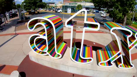 A-nice-steady-smooth-slow-motion-panning-shot-looking-down-at-The-ATX-sign-in-downtown-Austin-Texas