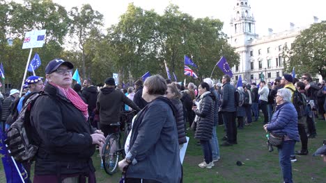People-listen-to-speeches-at-the-People's-Vote-protests-in-London,-UK