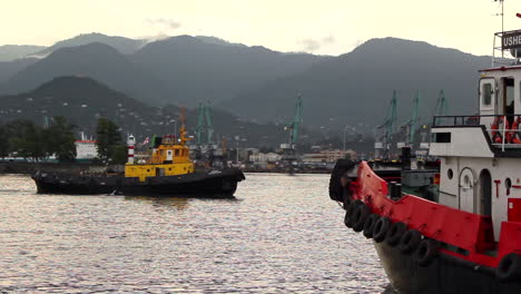 Industrial-harbor,-as-a-boat-sailing-on-calm-waters