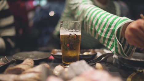 Group-Of-People-Having-A-Meal-With-Beer-Inside-The-Restaurant-In-Kyoto,-Japan