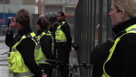 Tower-Hamlets-council-enforcement-officers-observe-a-minute-silence-for-healthcare-staff-who-died-due-to-the-Coronavirus-outbreak-on-Workers-Memorial-Day-outside-The-Royal-London-Hospital