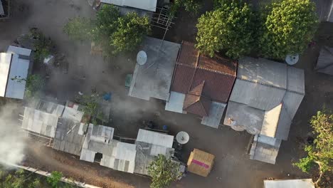 Top-View-Of-Houses-in-Gerupuk-Fisher-Village,-South-Lombok,-Indonesia---Drone-Ascend