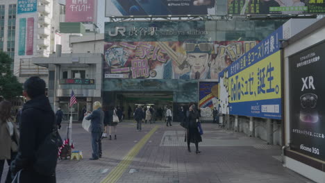 People-Looking-And-Passing-By-A-Man-Dressed-As-Donald-Trump-Outside-The-Shibuya-Station-During-COVID-19-In-Tokyo,-Japan