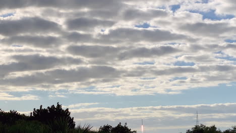A-view-of-a-rocket-taking-off-and-flying-into-space-through-the-clouds