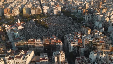 Aerial-high-angle-shot-flying-towards-La-Recoleta-Cemetery-in-Buenos-Aires-at-golden-hour