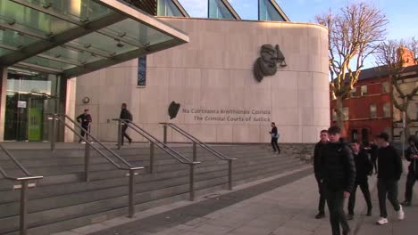 People-passing-by-Dublin-Criminal-Courts-Of-Justice-in-December-2020-wintertime