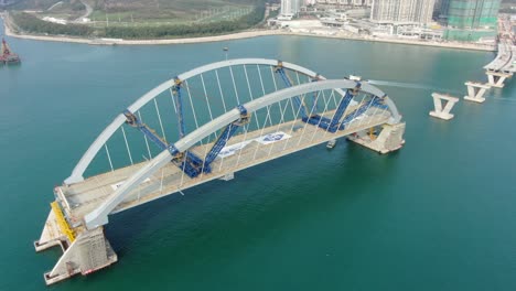 Hong-Kong-cross-bay-link-construction-project,-a-dual-two-lane-bridge-connecting-Tseung-Kwan-O-Lam-Tin-Tunnel-to-Wan-Po-Road,-Aerial-view