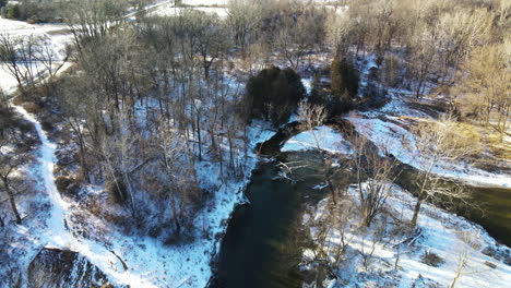 Aerial-views-of-Michigan-park-and-stream-during-winter